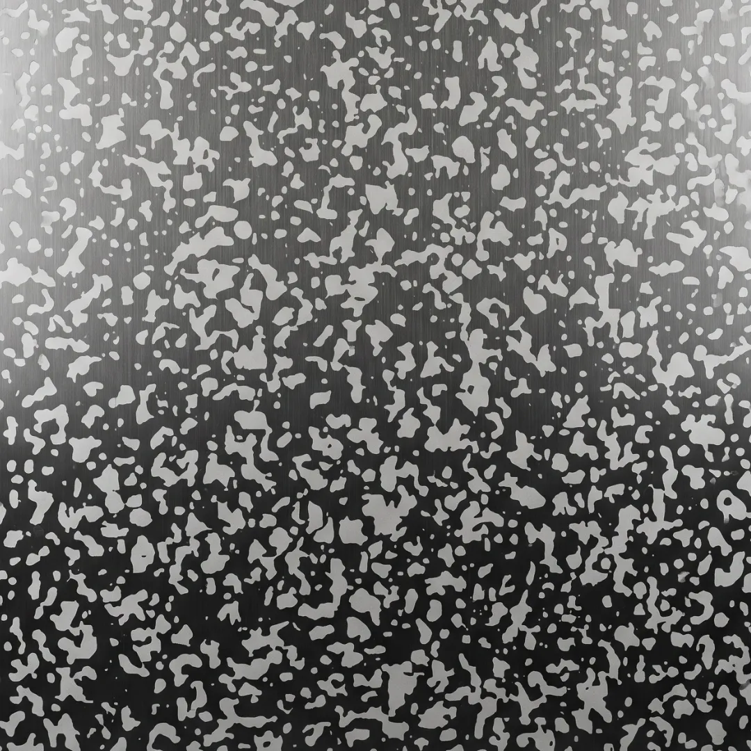 Speckle pattern of small irregular flecks etched at varying density across a dark hairline ground