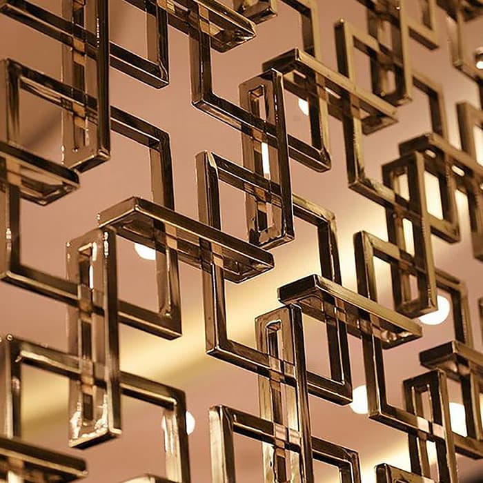 Gold PVD-coated decorative laser-cut screen