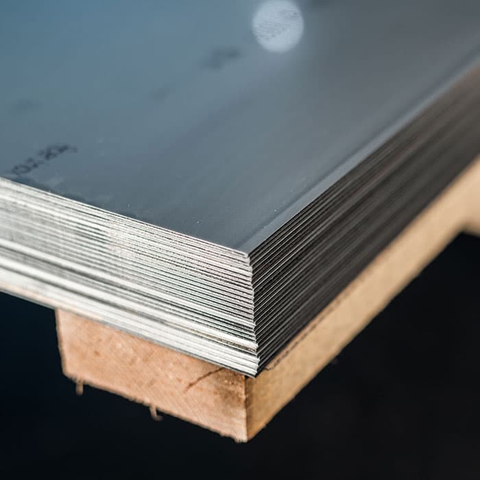 Stack of steel sheets on a timber pallet, corner close up